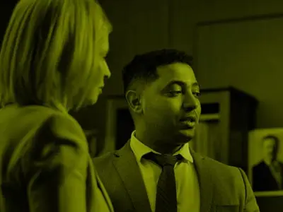 Man and woman talking in meeting